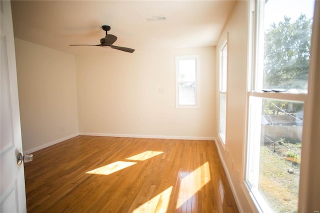 unfurnished room featuring light hardwood / wood-style floors and ceiling fan