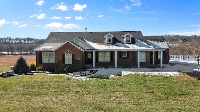 view of front facade with a front lawn and a porch