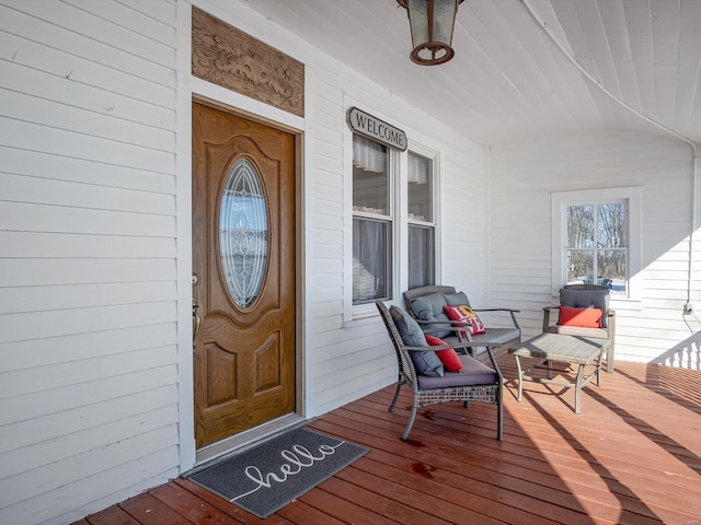 view of exterior entry with a porch