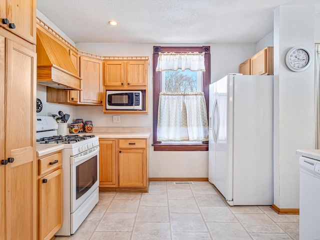 kitchen featuring white appliances, premium range hood, light countertops, and light brown cabinetry