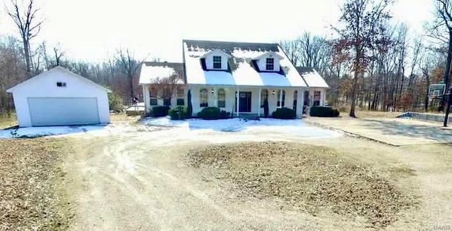 view of front of house with an outdoor structure, covered porch, and a garage