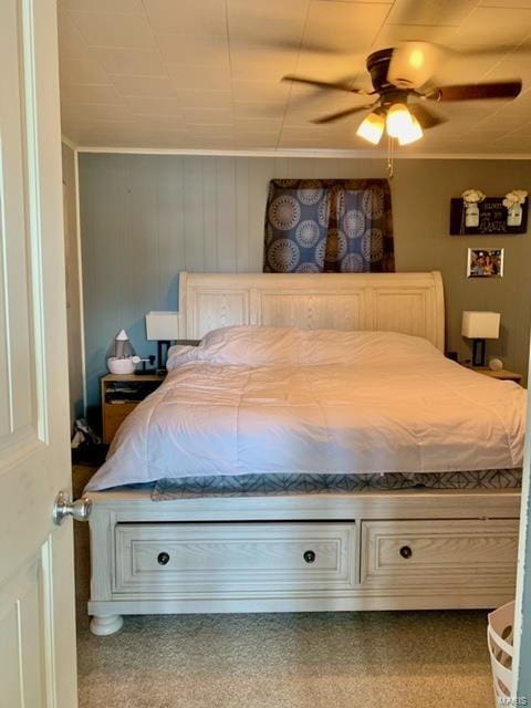 bedroom featuring ceiling fan and crown molding