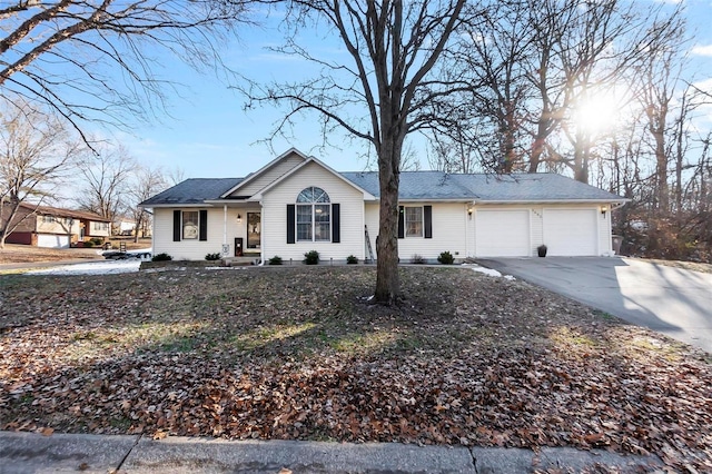 ranch-style home featuring a garage