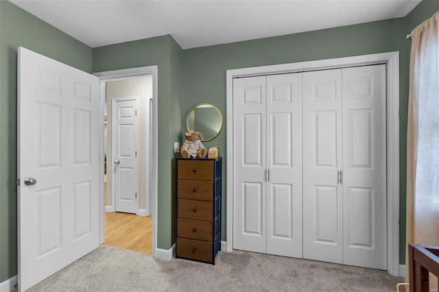 carpeted bedroom featuring a closet