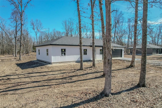 view of property exterior featuring a garage