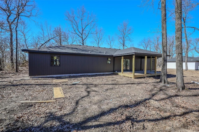 back of property featuring a deck