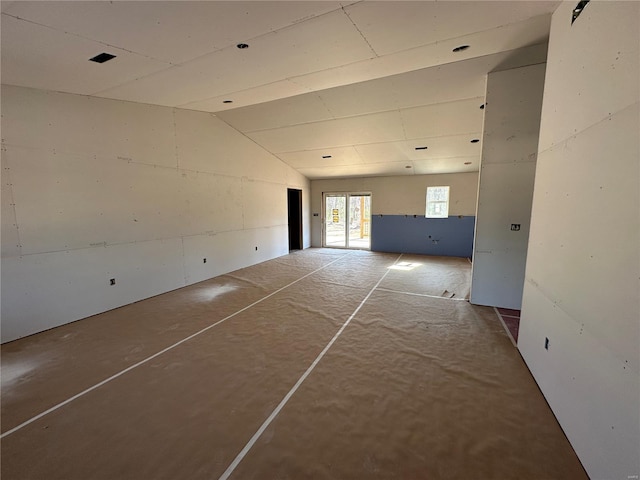 empty room with vaulted ceiling