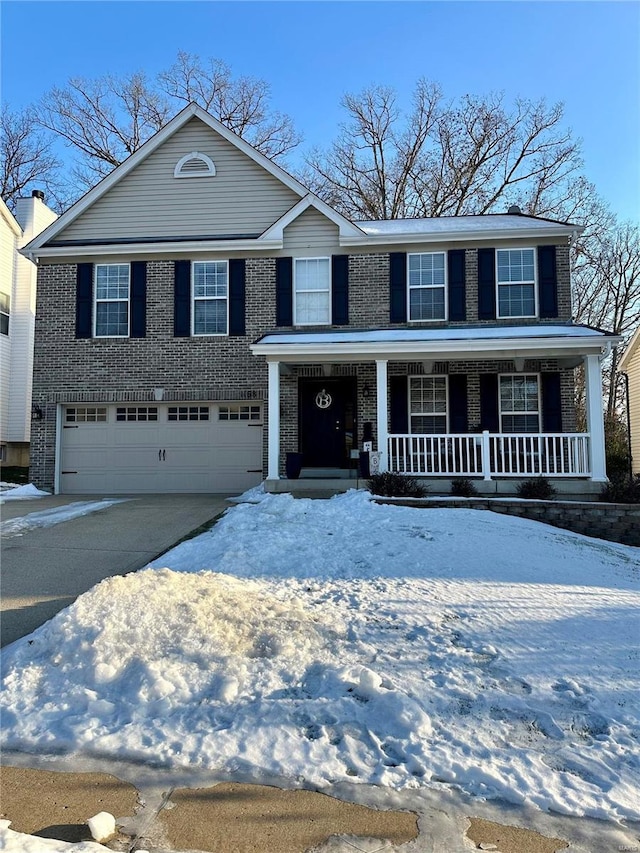 view of front facade featuring a garage and covered porch