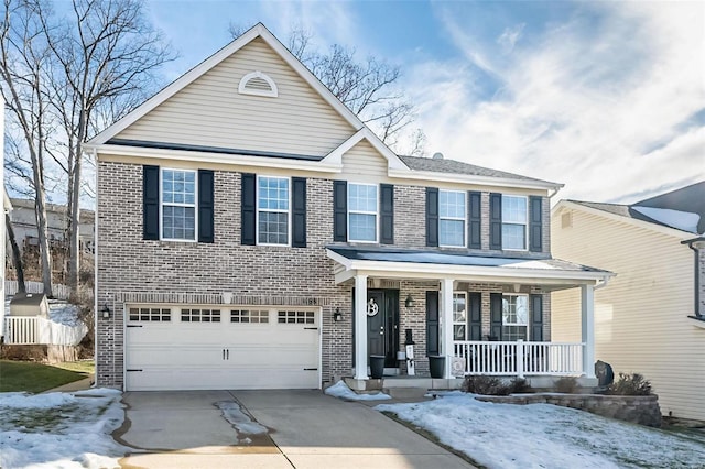 traditional-style home with covered porch, concrete driveway, brick siding, and an attached garage