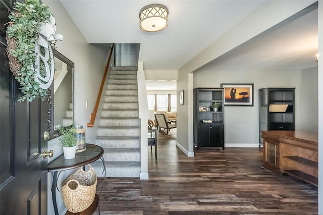 foyer with dark hardwood / wood-style flooring