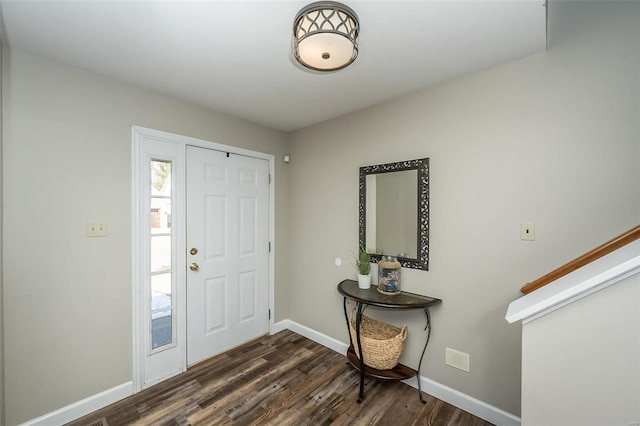 foyer entrance with dark hardwood / wood-style floors