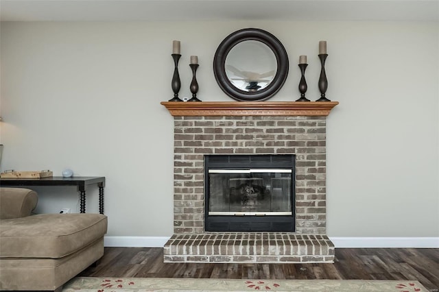 room details with a brick fireplace and hardwood / wood-style floors