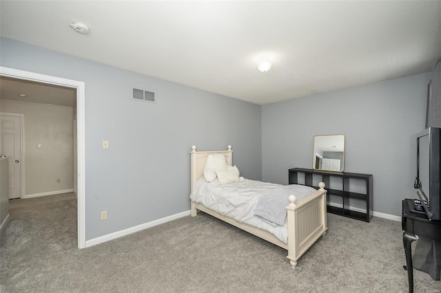 bedroom featuring light carpet