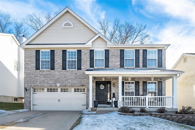 view of front of property with a garage, driveway, brick siding, and a porch