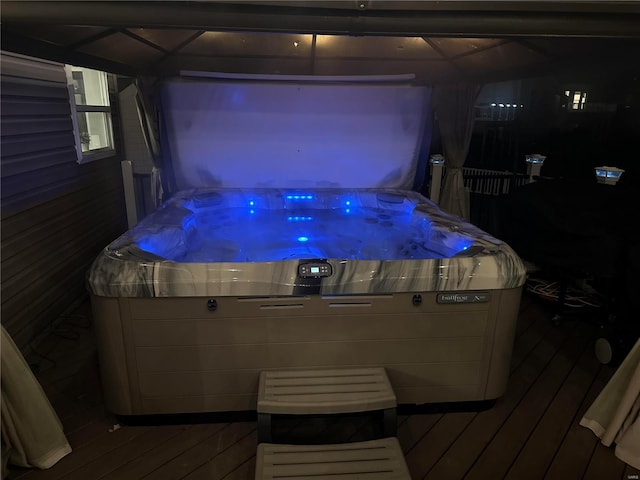 wooden deck featuring a gazebo and a hot tub