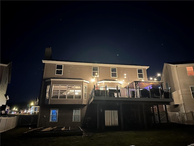 view of back house at night