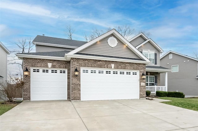 craftsman-style home with a garage and covered porch