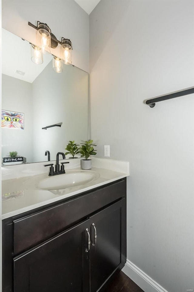 bathroom with vanity and wood-type flooring