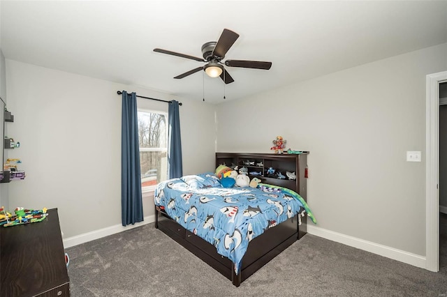 bedroom with ceiling fan and dark carpet