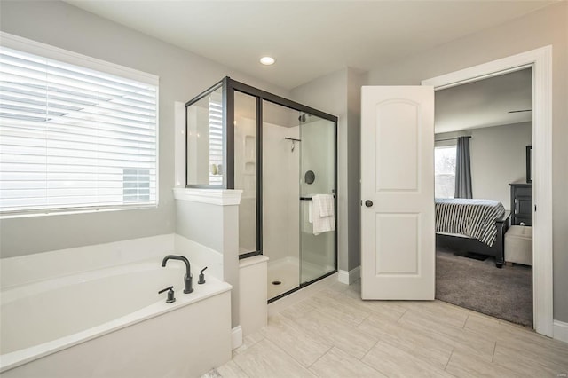 bathroom with separate shower and tub