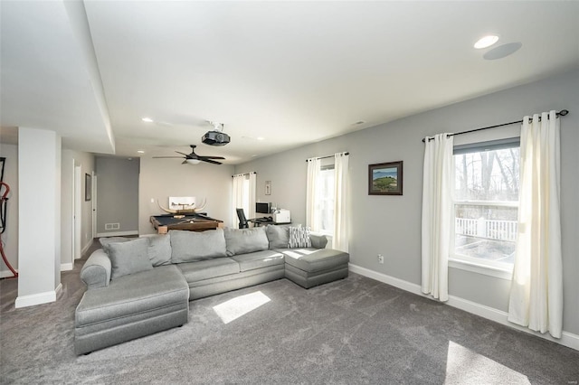 carpeted living room featuring ceiling fan