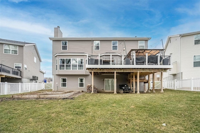 back of property with a yard, a gazebo, and a deck