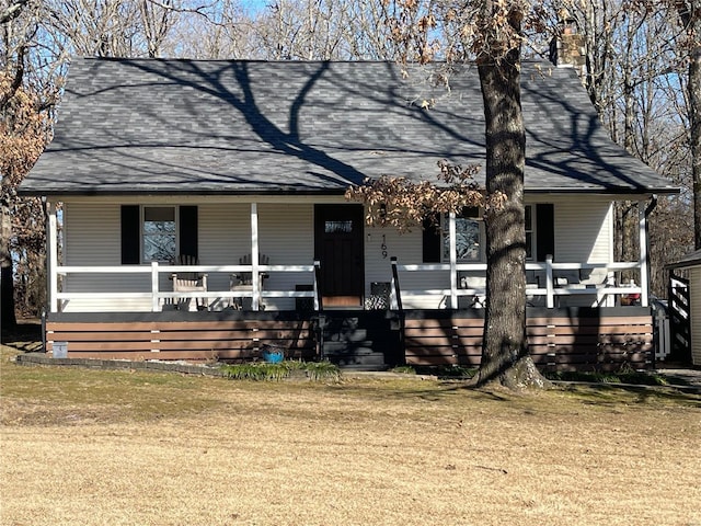 view of front facade with a front lawn and a porch