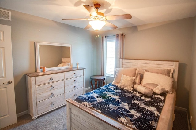 bedroom featuring ceiling fan and dark carpet