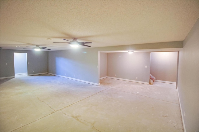 unfurnished room featuring a textured ceiling and ceiling fan