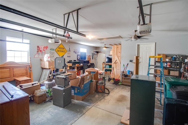 garage with a garage door opener and ceiling fan