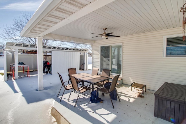 view of patio / terrace with ceiling fan and a pergola