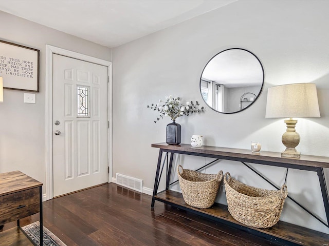 entryway with dark wood-type flooring