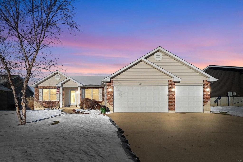 single story home with a garage