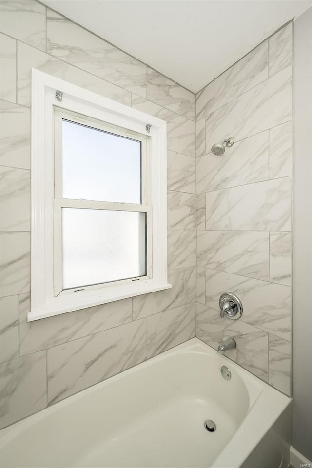 bathroom with tub / shower combination