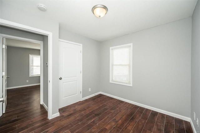 spare room featuring dark hardwood / wood-style floors