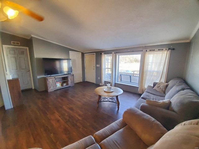 living room with crown molding, lofted ceiling, dark hardwood / wood-style floors, and ceiling fan