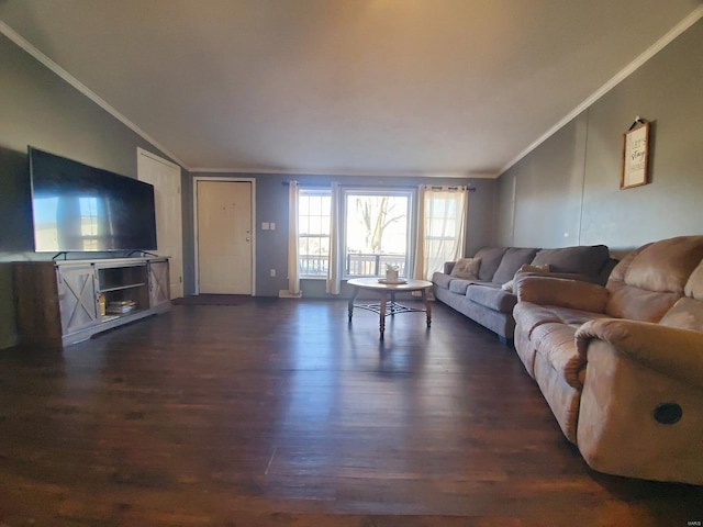 living room with ornamental molding, lofted ceiling, and dark hardwood / wood-style floors