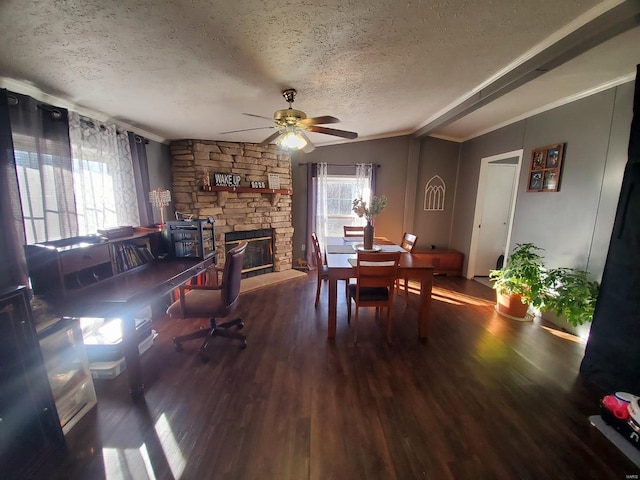 dining space featuring a textured ceiling, crown molding, and wood-type flooring