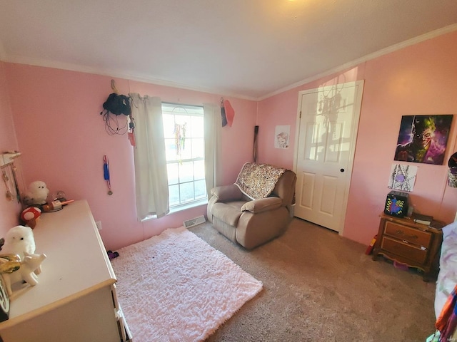 sitting room featuring crown molding and carpet flooring