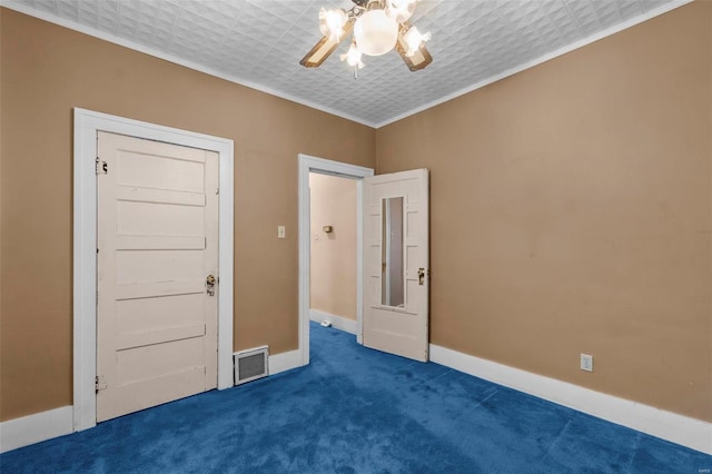 carpeted spare room with ornamental molding