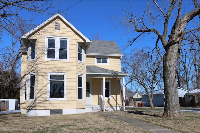 view of front of house featuring a front yard and a porch