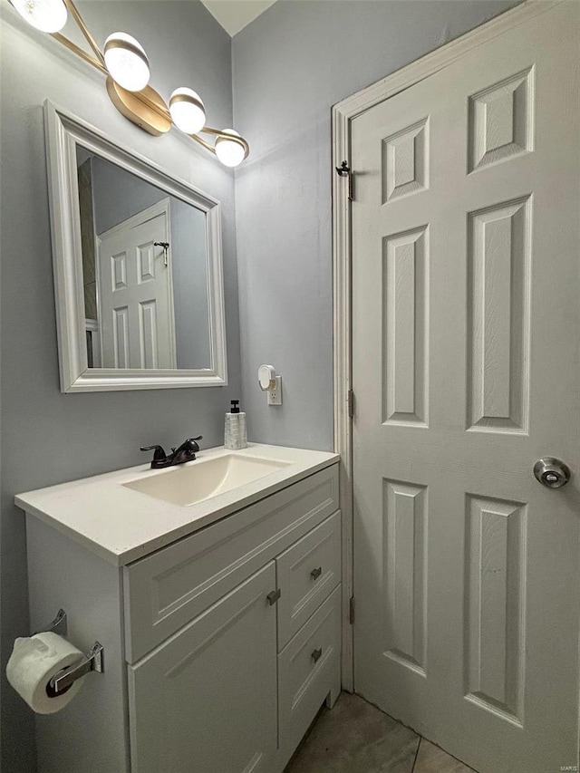 bathroom featuring tile patterned floors and vanity