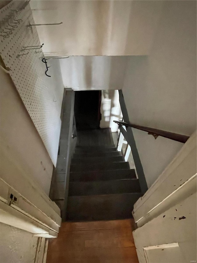 stairway featuring hardwood / wood-style floors