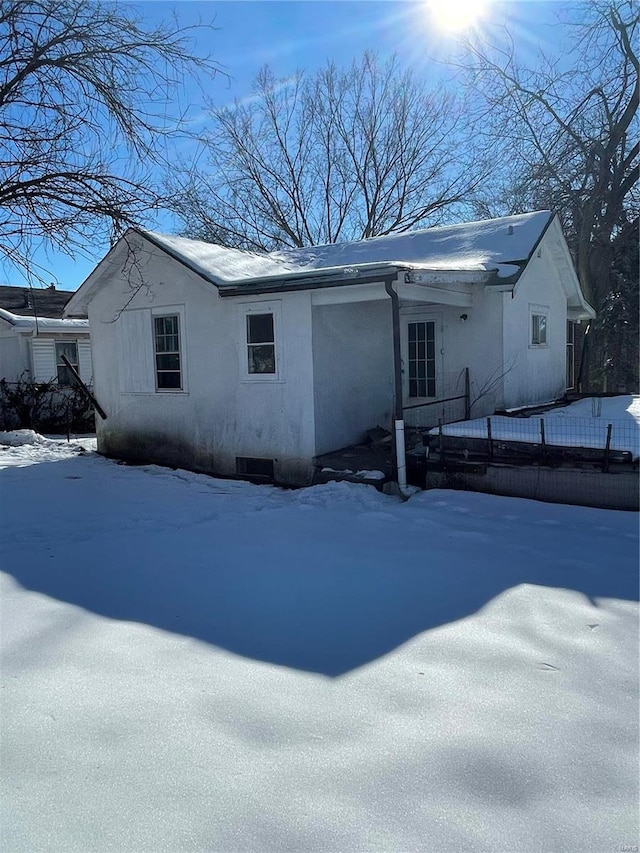 view of snow covered house