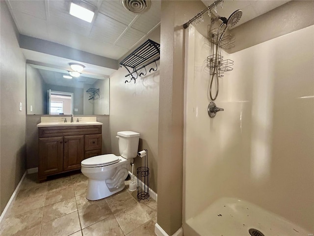 bathroom with a shower, vanity, and toilet