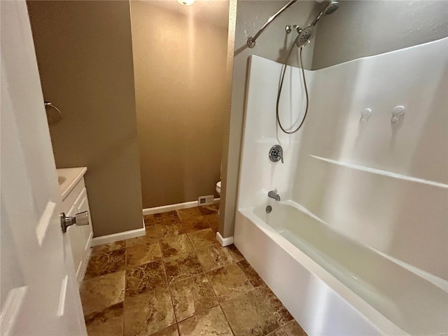 full bathroom featuring vanity, shower / tub combination, and toilet