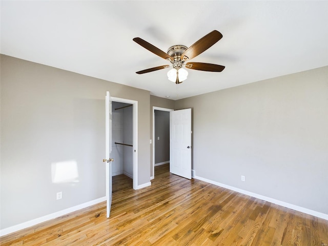 unfurnished bedroom with ceiling fan and light wood-type flooring