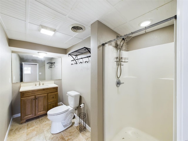 bathroom with vanity, curtained shower, and toilet