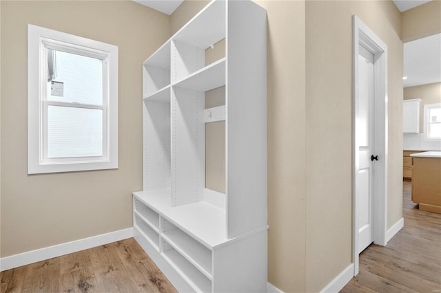 mudroom with light hardwood / wood-style floors