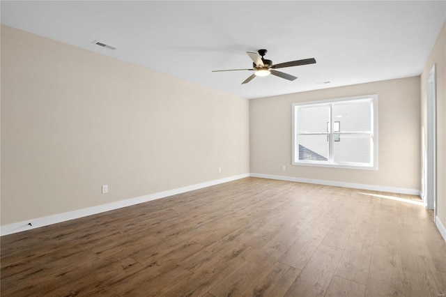 empty room featuring ceiling fan and wood-type flooring